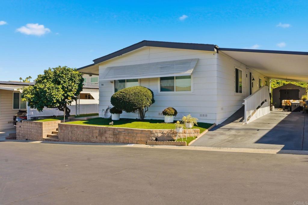 1195 La Moree Road, Unit 98 San Marcos, CA 92078 - Photo 28 of 28 a view of a house with backyard and sitting area