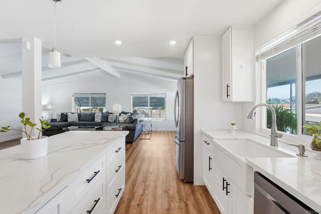 1195 La Moree Road, Unit 98 San Marcos, CA 92078 - Photo 5 of 28 a view of a kitchen counter space a sink wooden floor and windows
