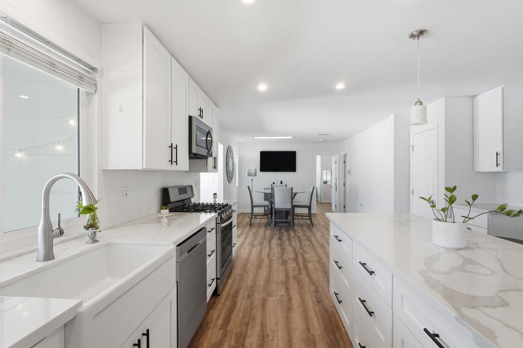 1195 La Moree Road, Unit 98 San Marcos, CA 92078 - Photo 7 of 28 a kitchen with sink a stove and cabinets