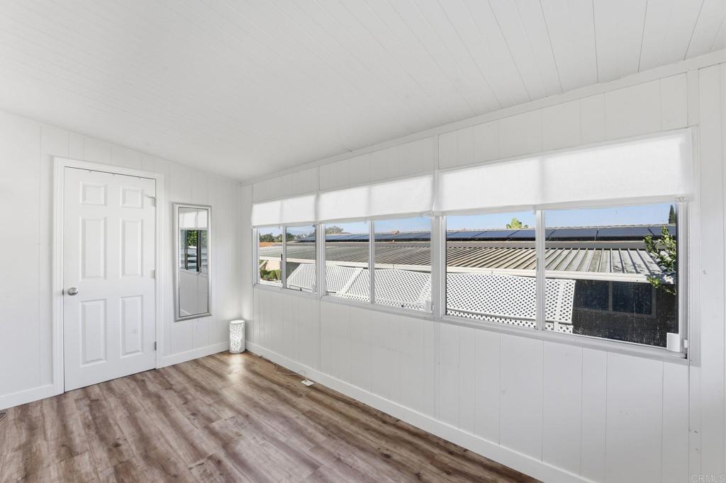 1195 La Moree Road, Unit 98 San Marcos, CA 92078 - Photo 10 of 28 a view of an empty room with a window and wooden floor