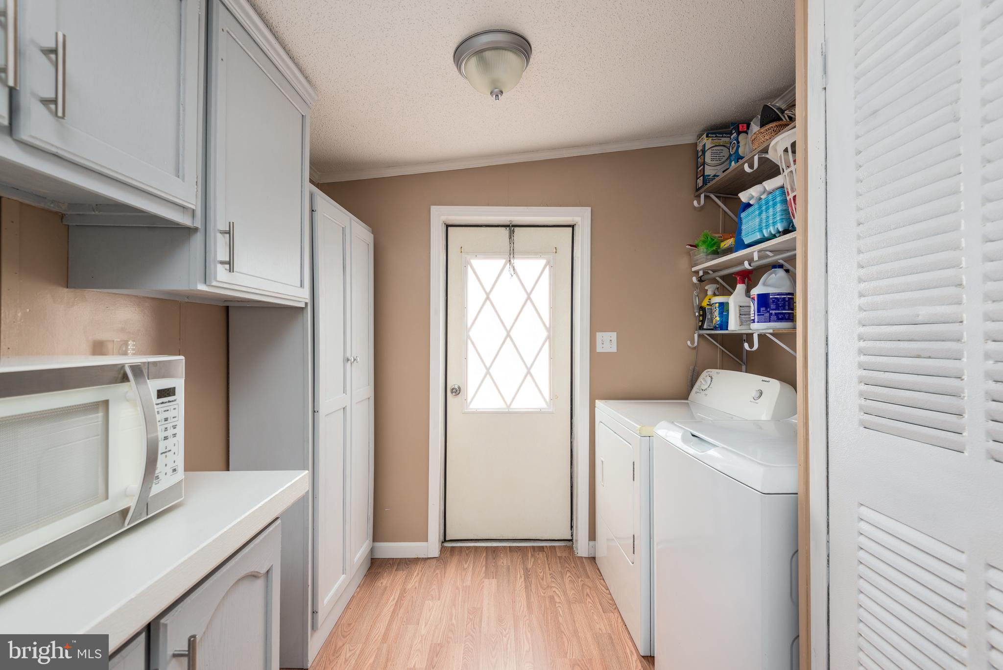 146 Bear Pond Road Marydel, MD 21649 - Photo 13 of 29 a room with storage and utility