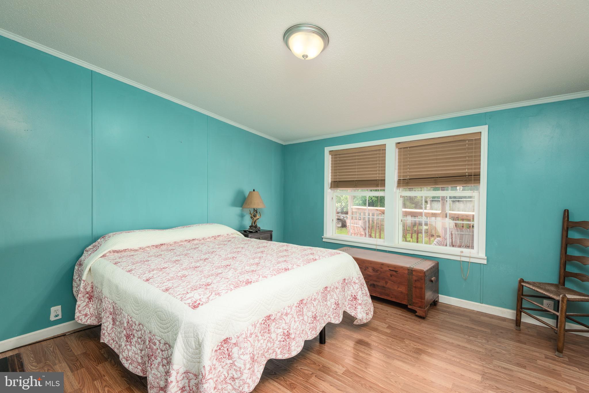 146 Bear Pond Road Marydel, MD 21649 - Photo 16 of 29 a bedroom with a bed and a window