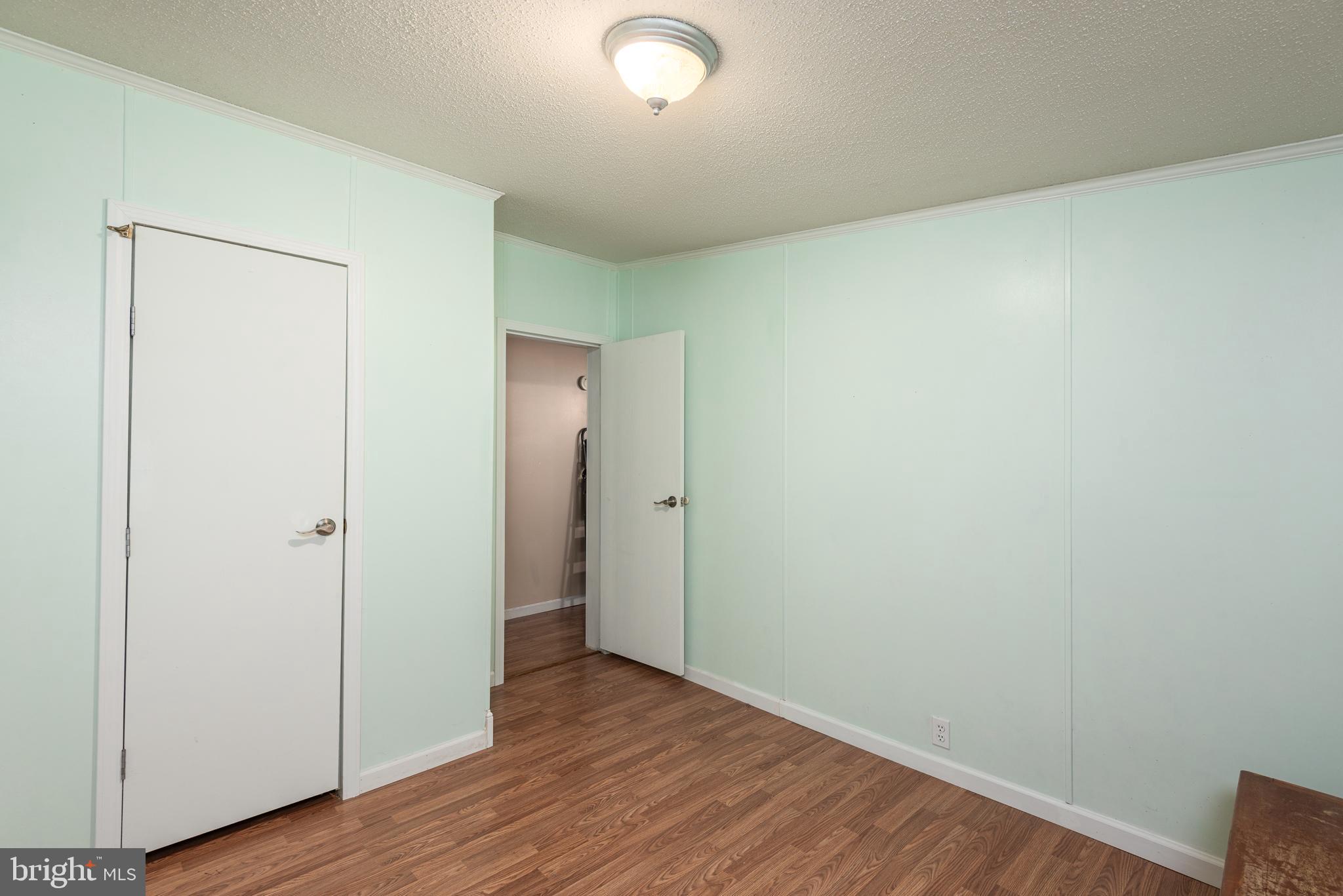 146 Bear Pond Road Marydel, MD 21649 - Photo 21 of 29 a view of hallway with wooden floor