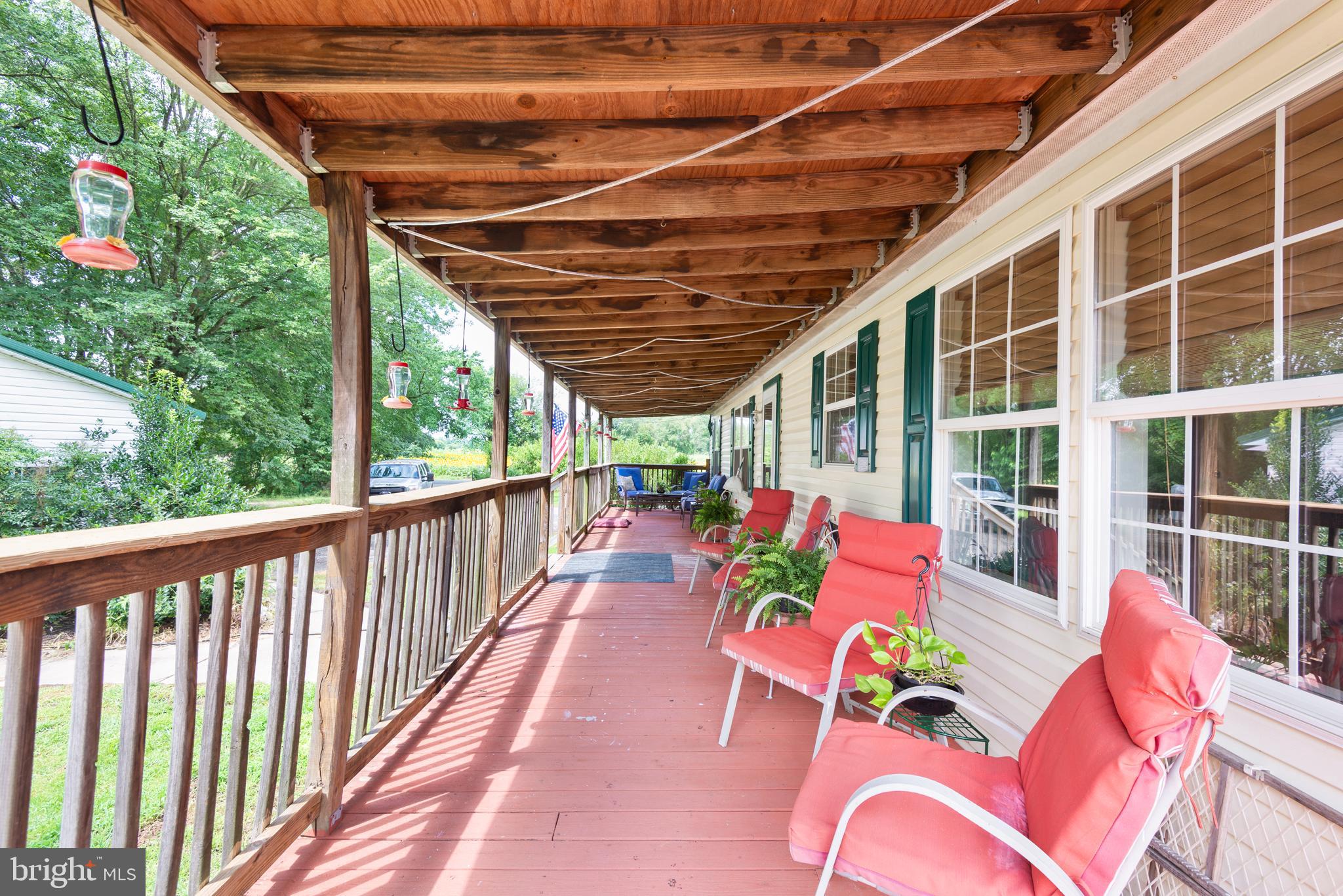 146 Bear Pond Road Marydel, MD 21649 - Photo 25 of 29 a balcony with furniture and garden view