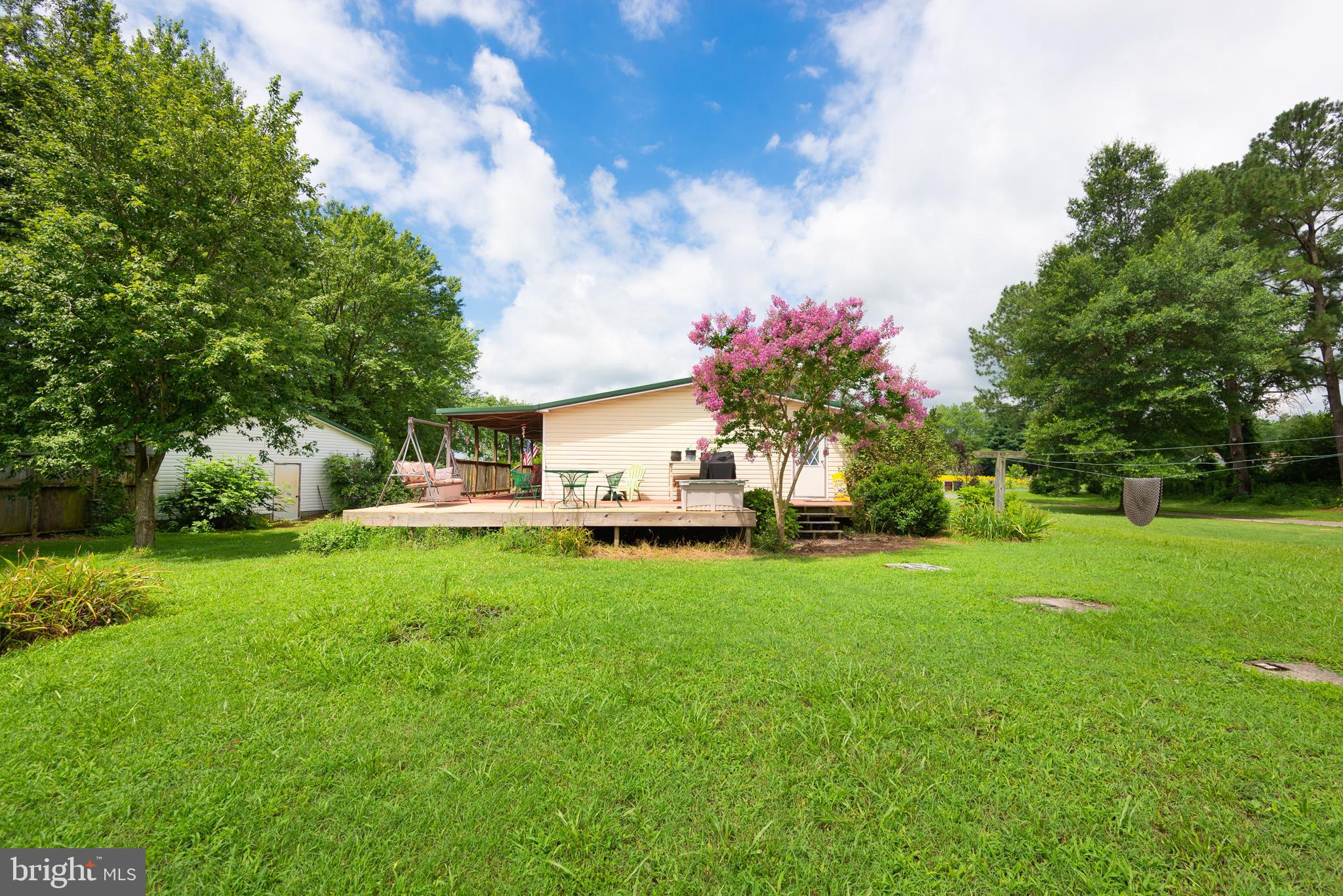 146 Bear Pond Road Marydel, MD 21649 - Photo 4 of 29 a front view of a house with garden
