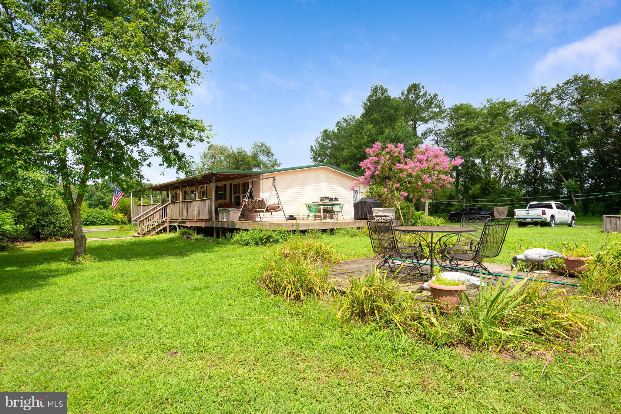 146 Bear Pond Road Marydel, MD 21649 - Photo 5 of 29 a view of a house with a big yard and sitting area