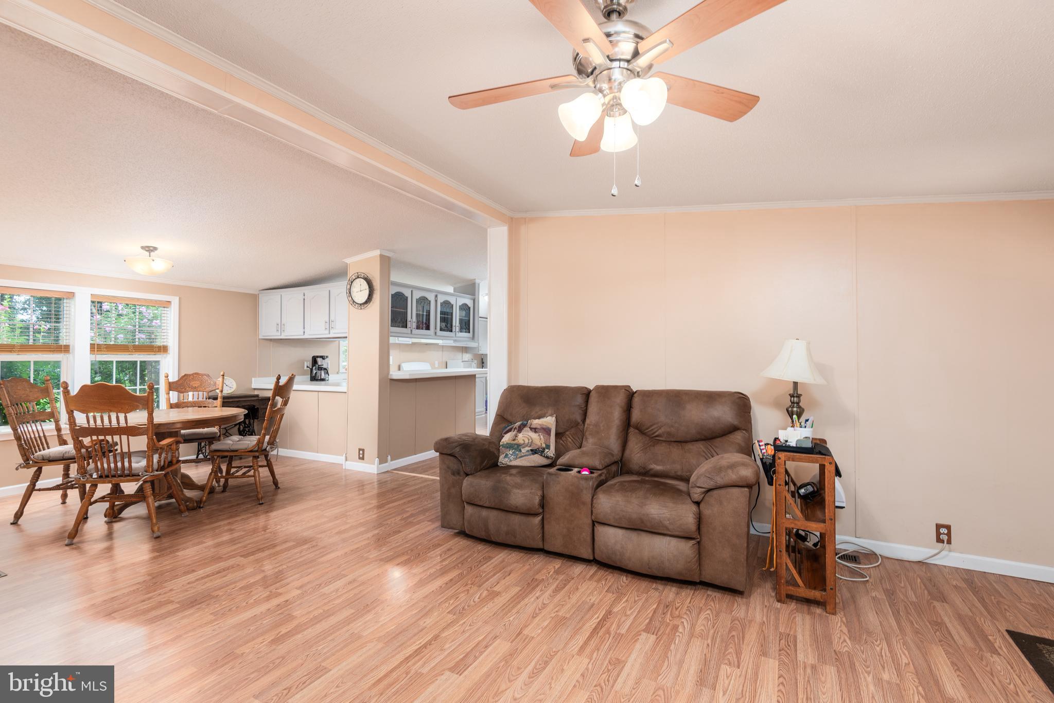 146 Bear Pond Road Marydel, MD 21649 - Photo 6 of 29 a living room with furniture and a wooden floor