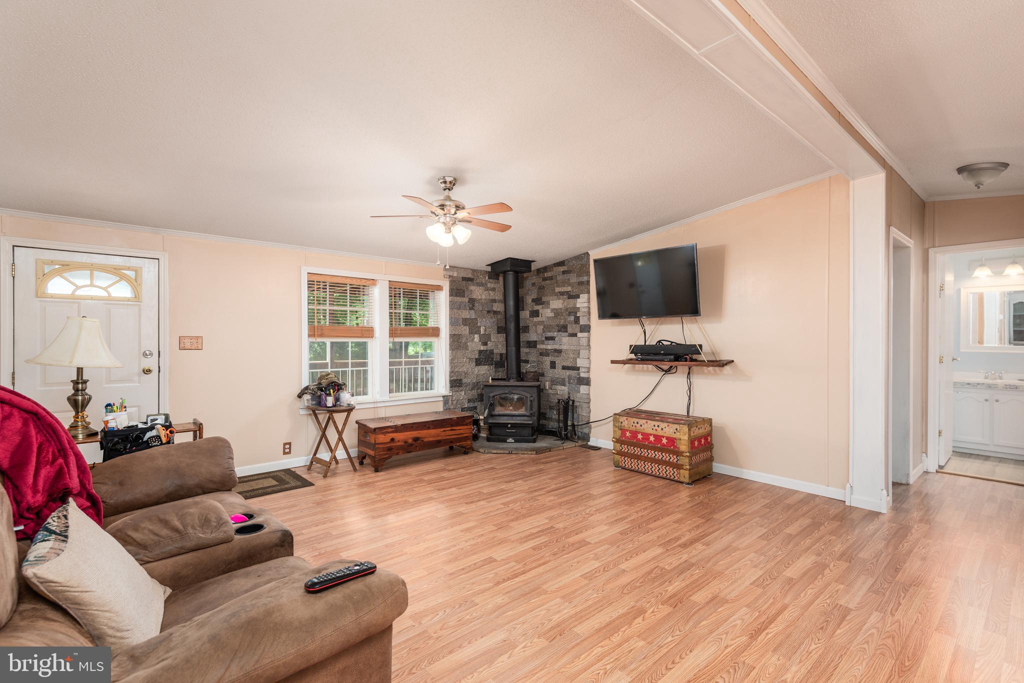 146 Bear Pond Road Marydel, MD 21649 - Photo 7 of 29 a bedroom with furniture and a flat screen tv
