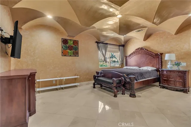 a bedroom with a bed and a dresser