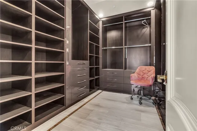 a view of a room with lots of wooden furniture