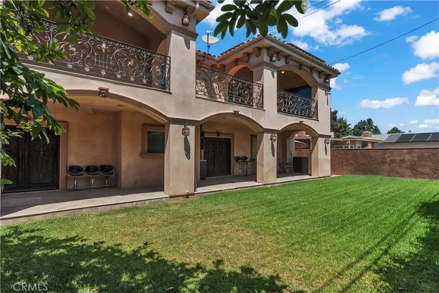 an aerial view of a house with a lake view