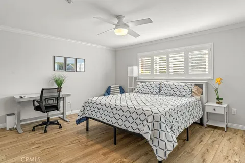 a bedroom with a bed and a table in it