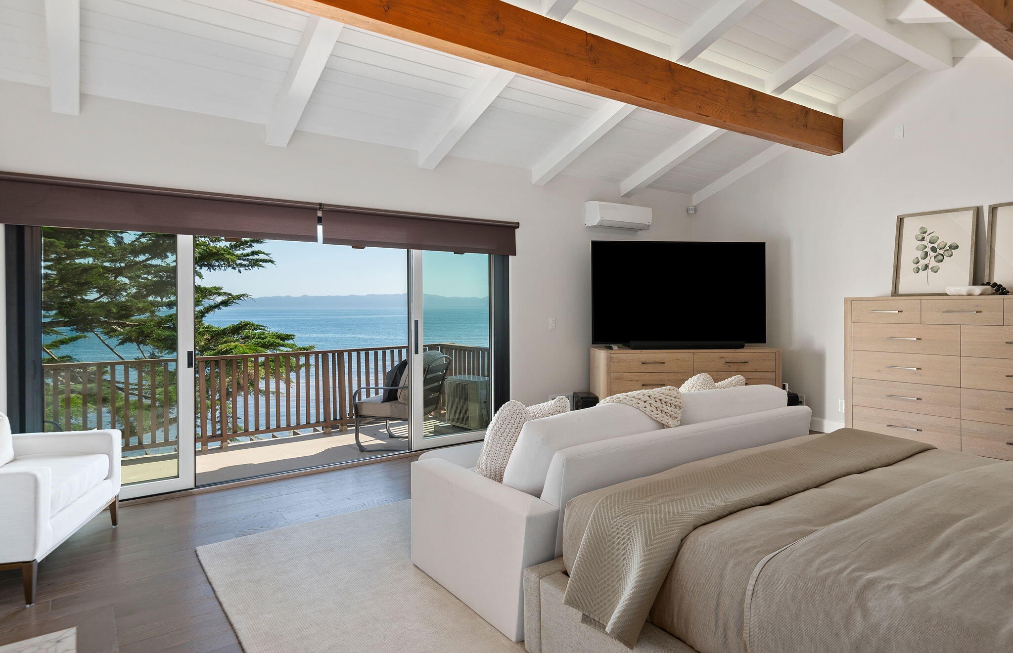 1409 Shoreline Drive Santa Barbara, CA 93109 - Photo 21 of 37 a bedroom with furniture a flat screen tv and a floor to ceiling window