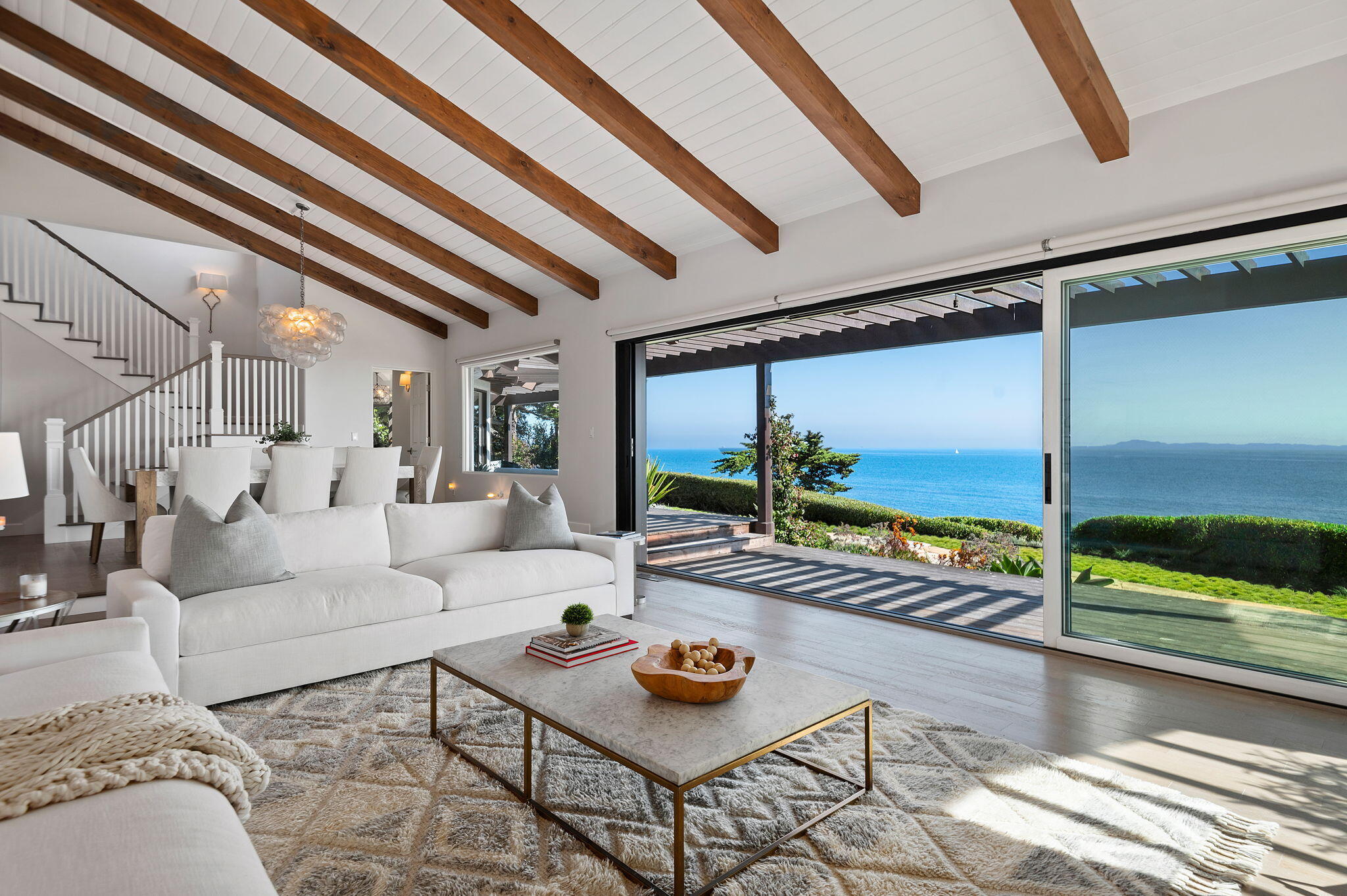 1409 Shoreline Drive Santa Barbara, CA 93109 - Photo 10 of 37 a living room with furniture and a floor to ceiling window