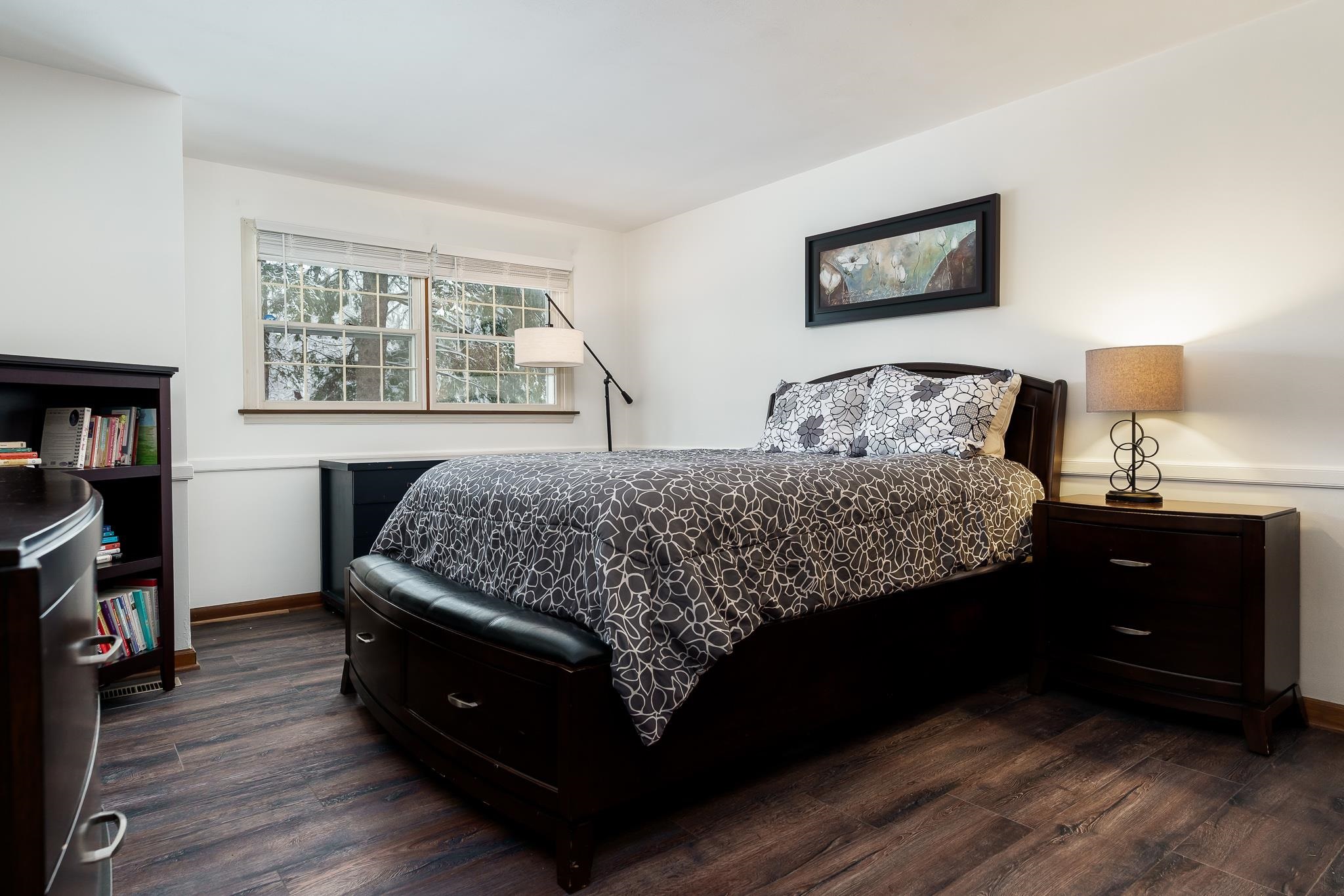 4702 Spring Brook Road Rockford, IL 61114 - Photo 54 of 70 a bedroom with a bed window and a night stand