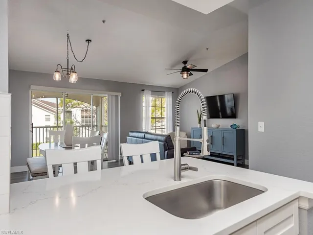 a kitchen with a refrigerator and a sink
