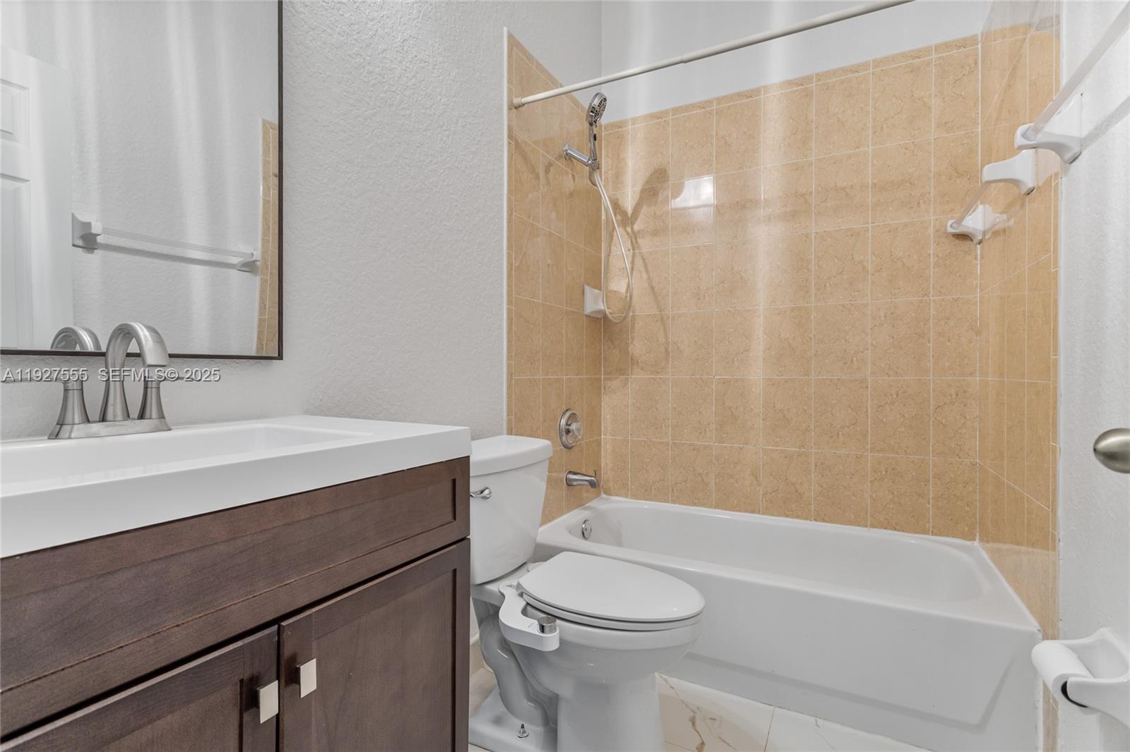 13148 Southwest 23rd Street Miramar, FL 33027 - Photo 18 of 24 a bathroom with a sink a toilet and shower