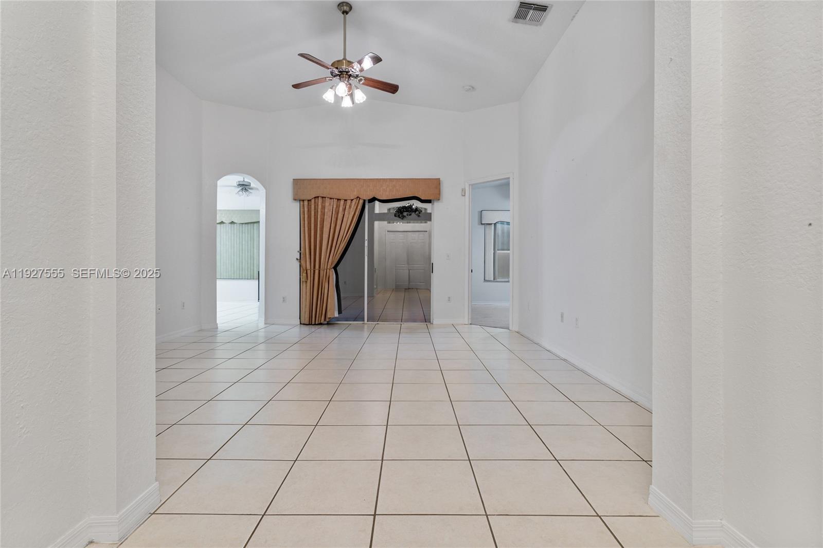 13148 Southwest 23rd Street Miramar, FL 33027 - Photo 3 of 24 a view of a livingroom with a chandelier