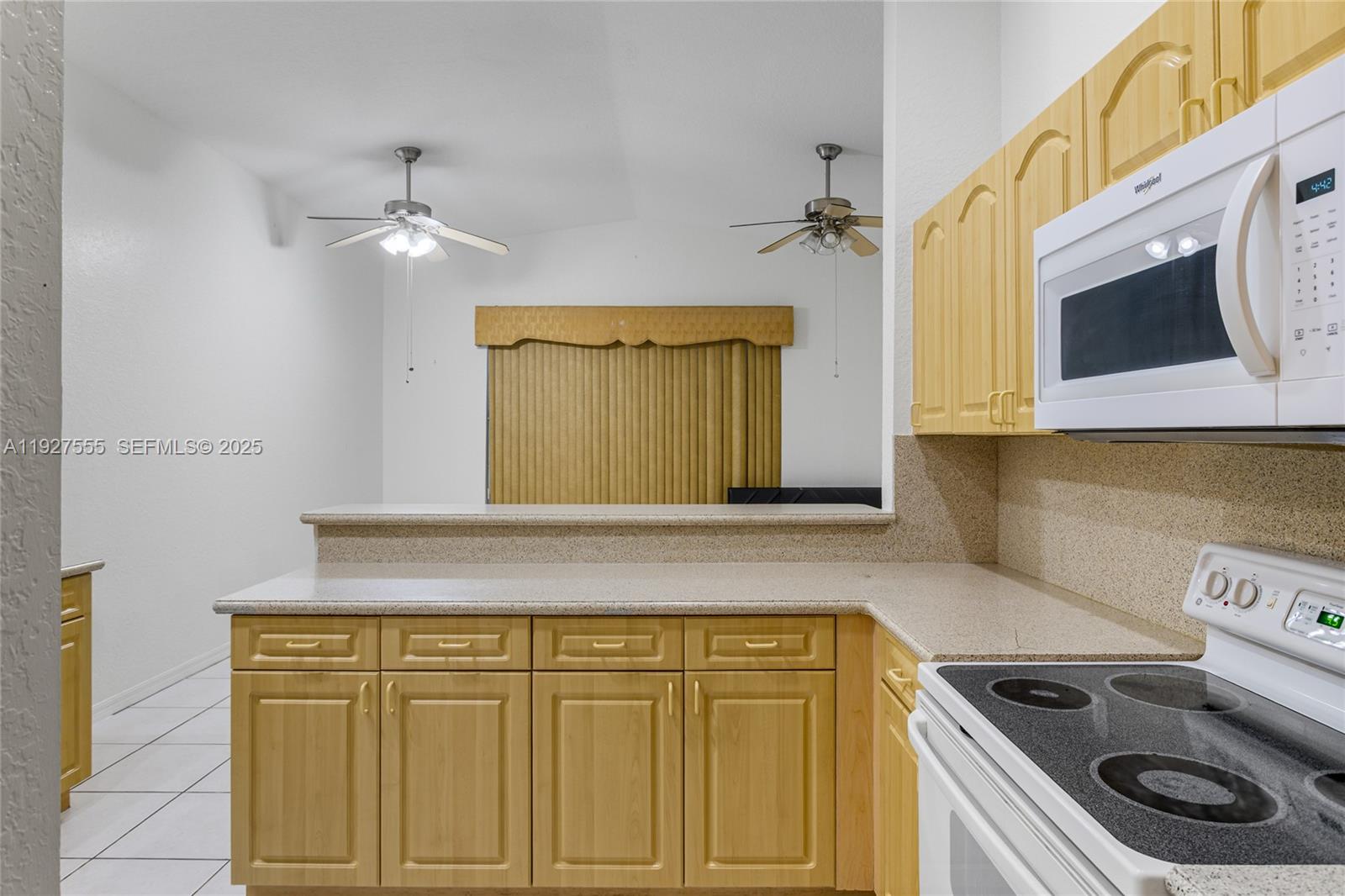 13148 Southwest 23rd Street Miramar, FL 33027 - Photo 7 of 24 a bathroom with a sink a washer and dryer