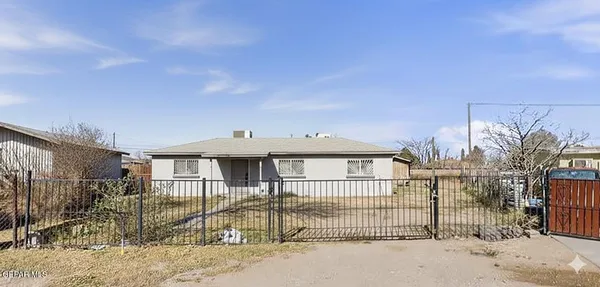 a view of a house with a fence