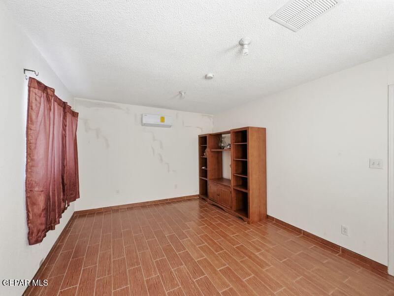 445 Suzi Way Socorro, TX 79927 - Photo 20 of 35 wooden floor in an empty room