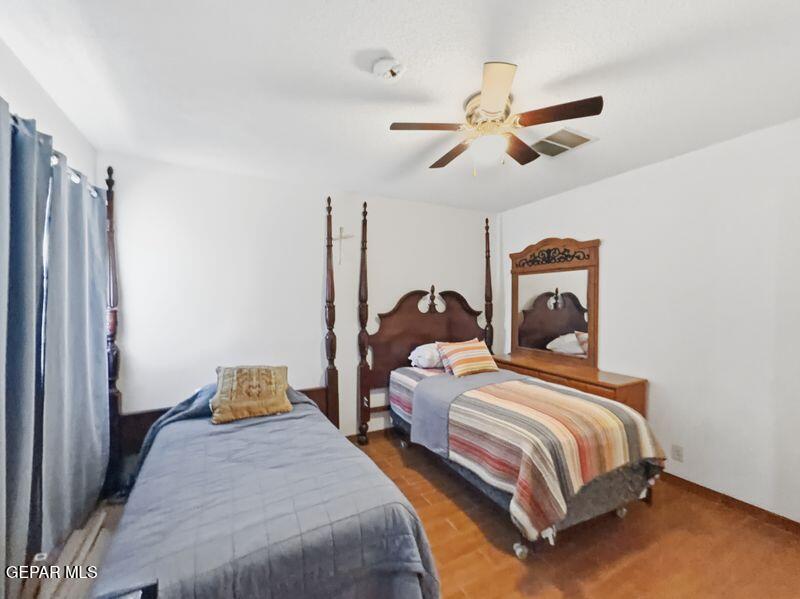 445 Suzi Way Socorro, TX 79927 - Photo 22 of 35 a bedroom with two beds and ceiling fan