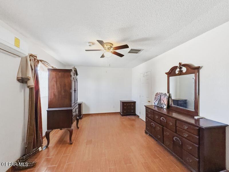 445 Suzi Way Socorro, TX 79927 - Photo 30 of 35 a bed room with a bed and a television