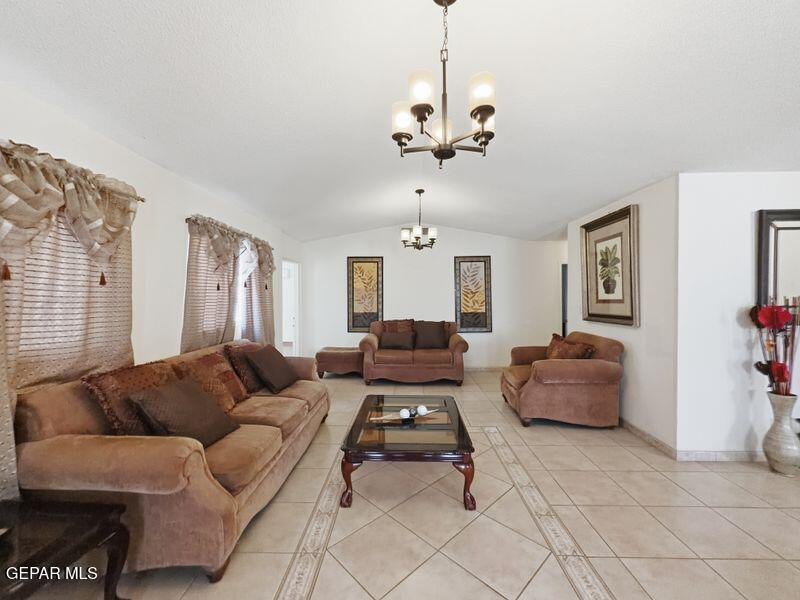 445 Suzi Way Socorro, TX 79927 - Photo 6 of 35 a living room with furniture and a chandelier