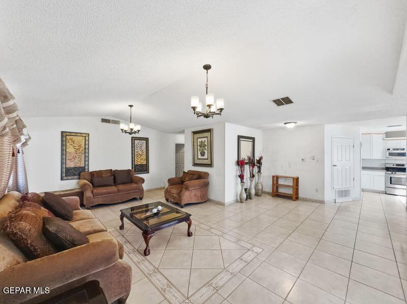 445 Suzi Way Socorro, TX 79927 - Photo 7 of 35 a living room with furniture and dining table