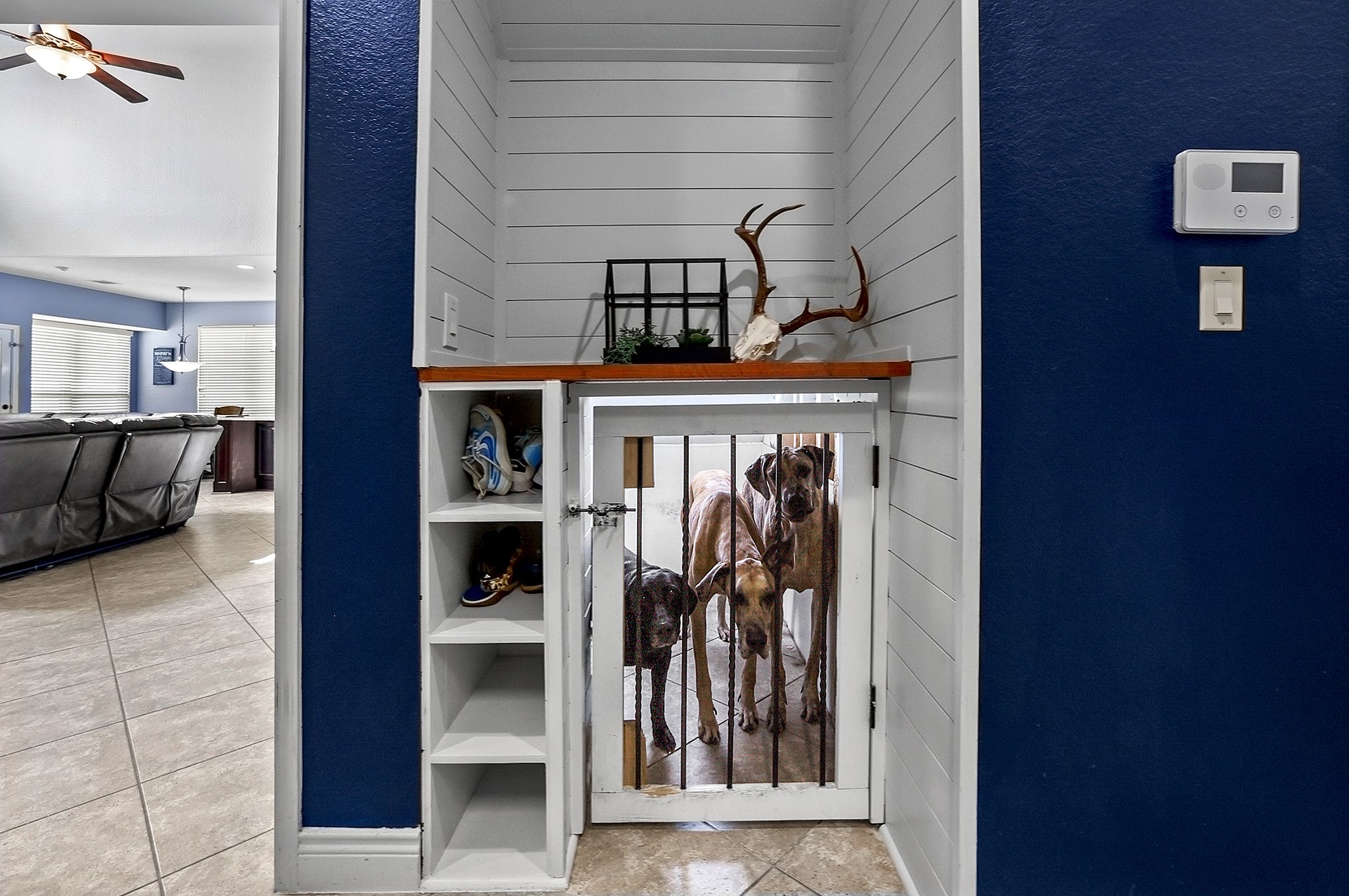2951 Bobby Jones Road Katy, TX 77494 - Photo 43 of 50 The mudroom provides convenient access to the garage and is currently being used by the owners as kennel space for their friendly fur babies. This versatile space could easily be redesigned to suit your needs, whether for a drop zone, storage, home organization, or another functional use.