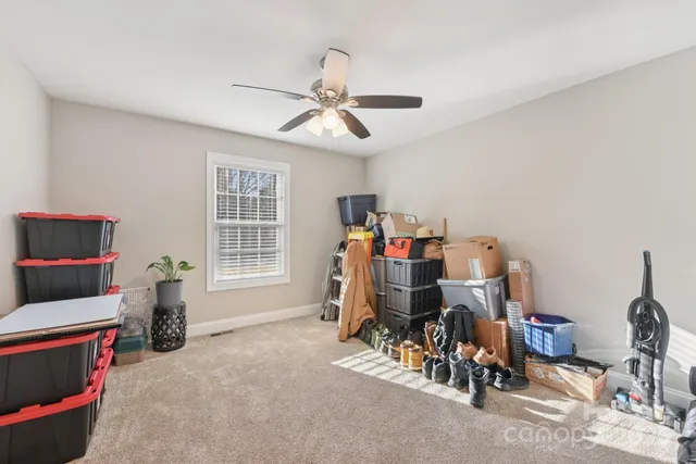 a view of a livingroom with furniture and a window