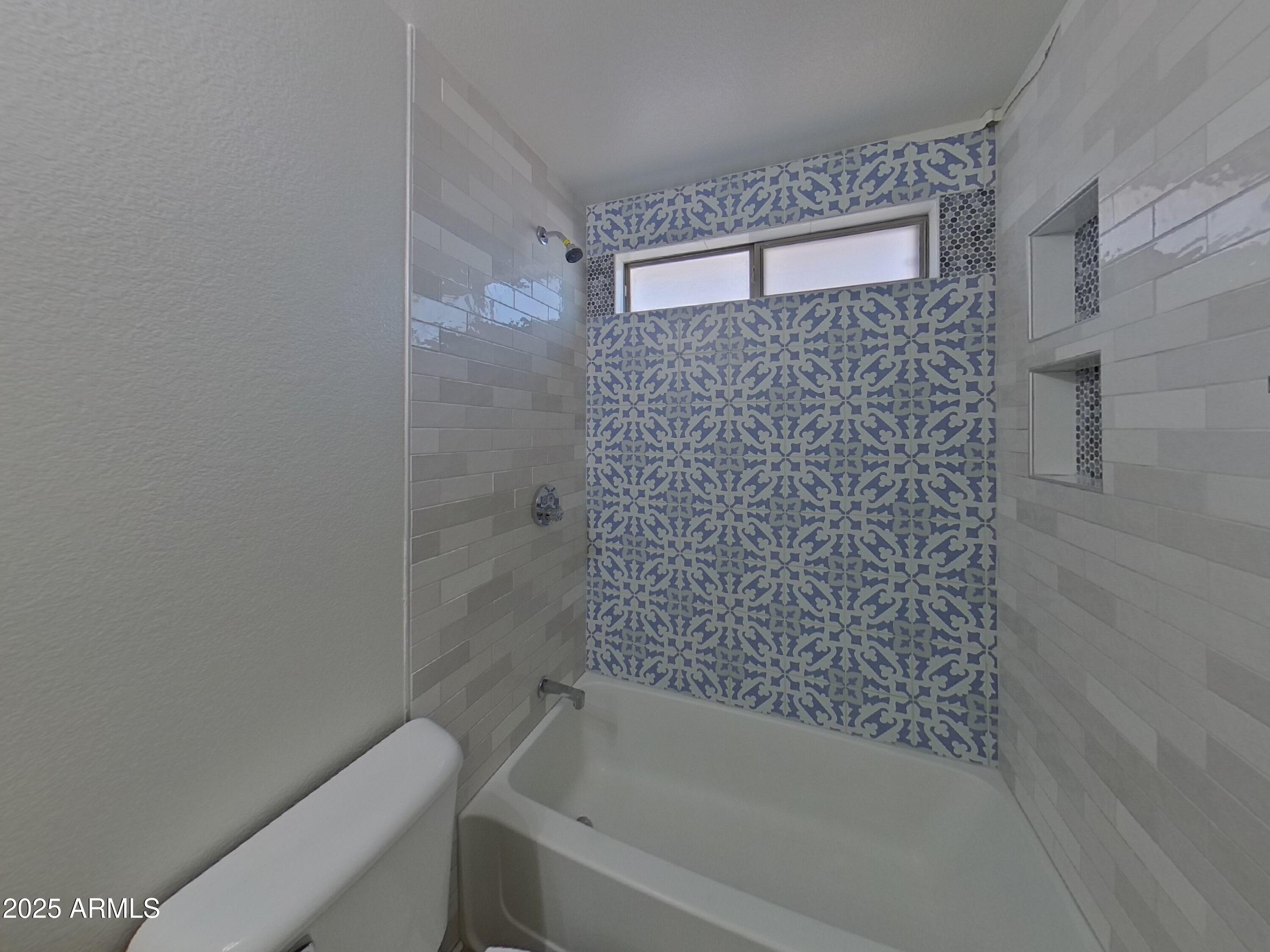 42396 Colby Drive Maricopa, AZ 85138 - Photo 15 of 17 a bathroom with a shower and a bathtub