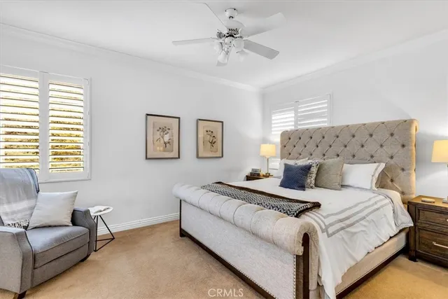 a bedroom with bed and a couch