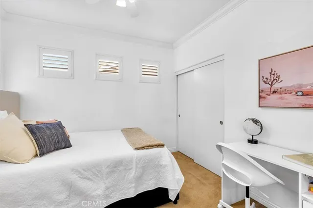 a bedroom with a bed and a table