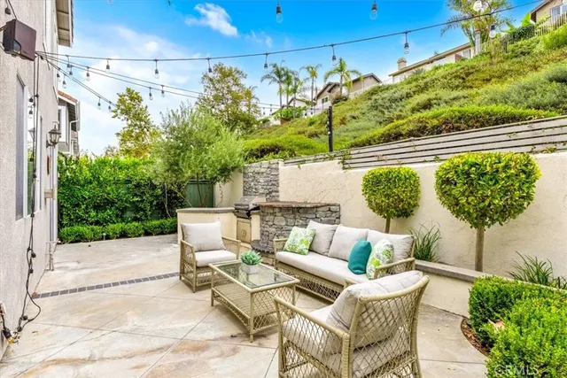 a view of a patio with couches and potted plants