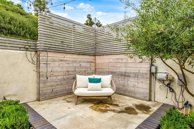 a view of a two chairs in the patio