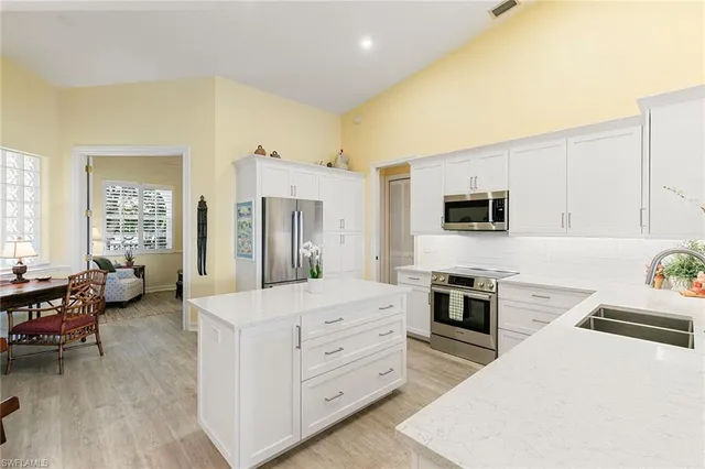 a view of a workspace with furniture and a book shelf