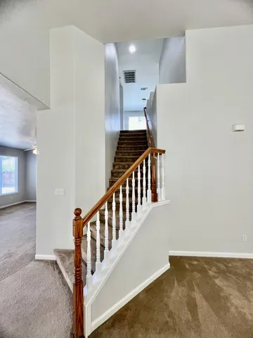 a view of a hallway with staircase