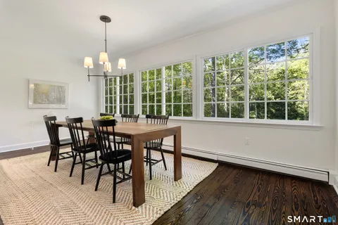a view of a dining room with furniture window and outside view