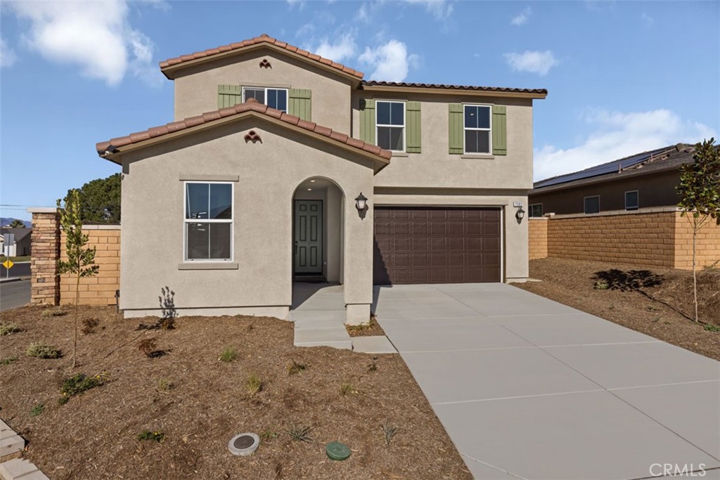 7502 Goldenfruit Circle Riverside, CA 92507 - Photo 1 of 1 a front view of a house with a yard