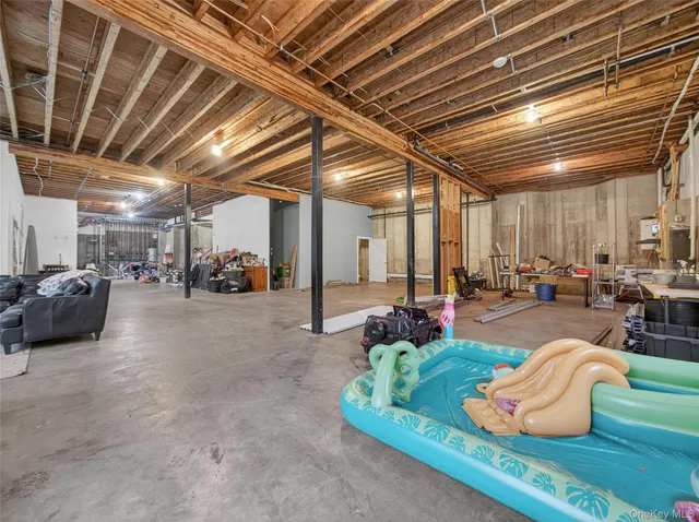 a lobby with furniture and a chandelier