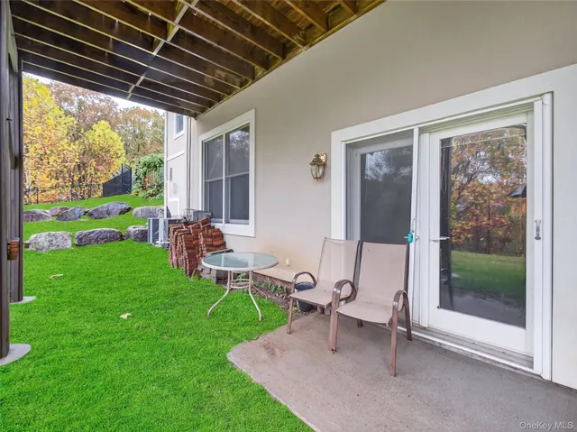 a house view with a sitting space and garden view