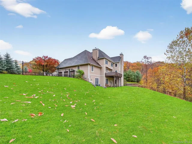 a view of a house with a backyard and a garden