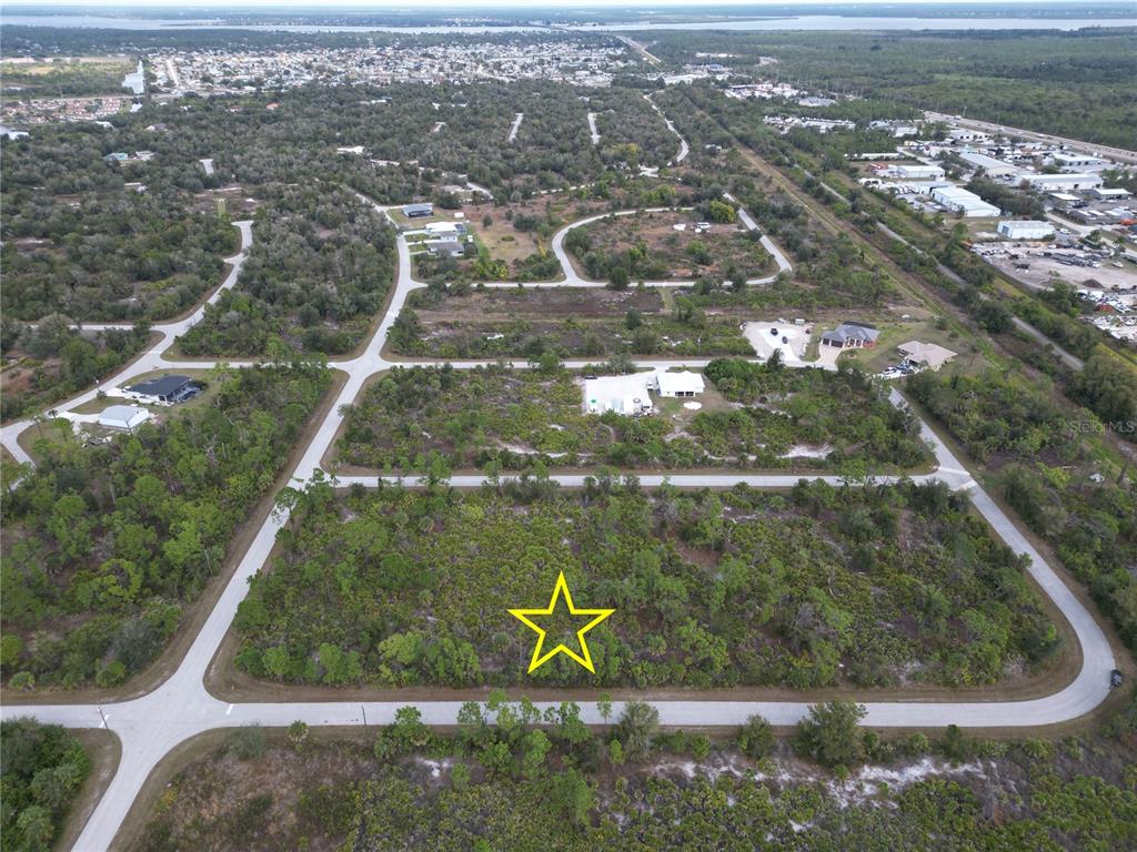 13250 Rouding Circle Port Charlotte, FL 33981 - Photo 3 of 9 an aerial view of residential houses with outdoor space