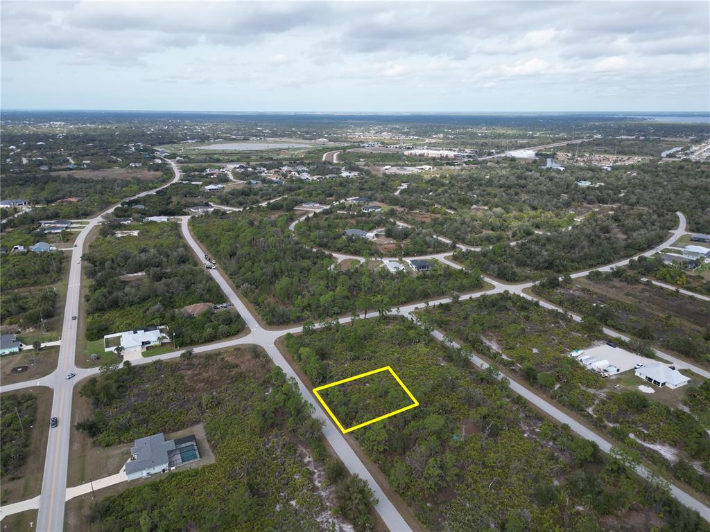13250 Rouding Circle Port Charlotte, FL 33981 - Photo 6 of 9 an aerial view of residential houses with outdoor space