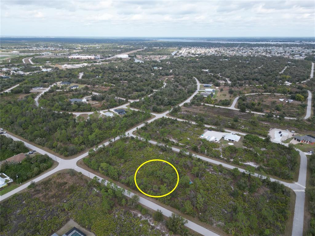 13250 Rouding Circle Port Charlotte, FL 33981 - Photo 7 of 9 an aerial view of a house with a yard and lake view