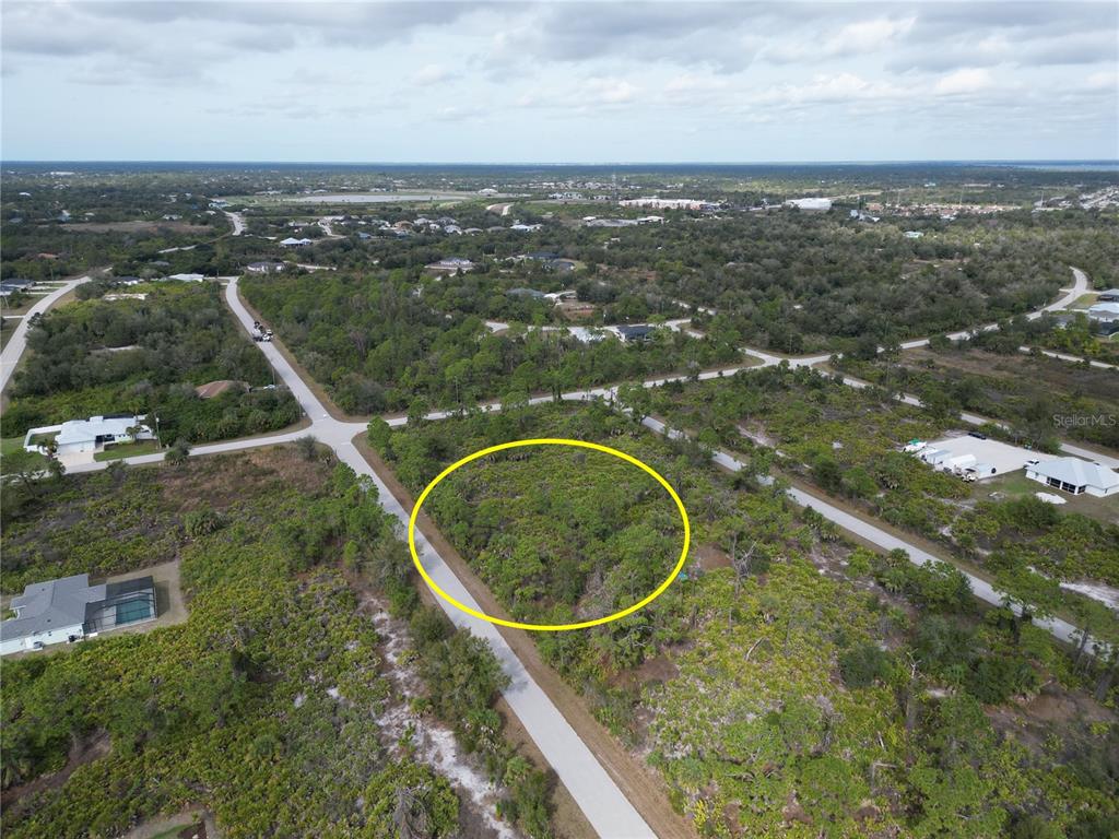 13250 Rouding Circle Port Charlotte, FL 33981 - Photo 8 of 9 an aerial view of a house with a yard and lake view