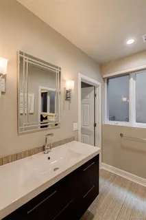 a bathroom with a glass shower door
