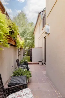 a view of balcony with furniture