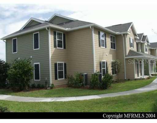 826 Enterprise Road, Unit 1106 DeBary, FL 32713 - Photo 1 of 1 a front view of a house with a garden